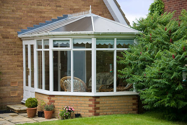 conservatory tables chairs plants room in house next to garden